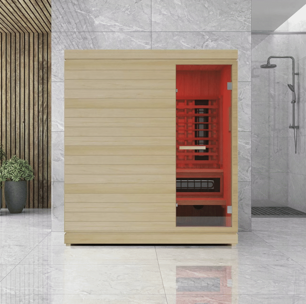 Infrared sauna with dual heating options, featuring red interior and modern design, set in a sleek, contemporary space with marble flooring and wooden accents.